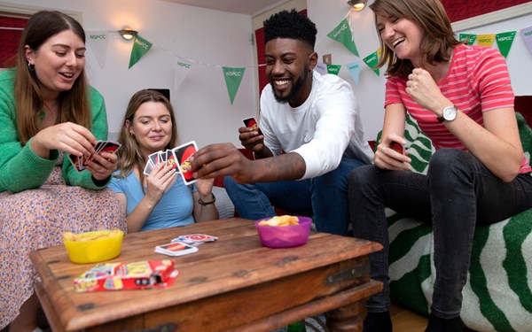 Group of people playing a card game