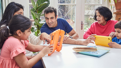 Family playing on tablet together