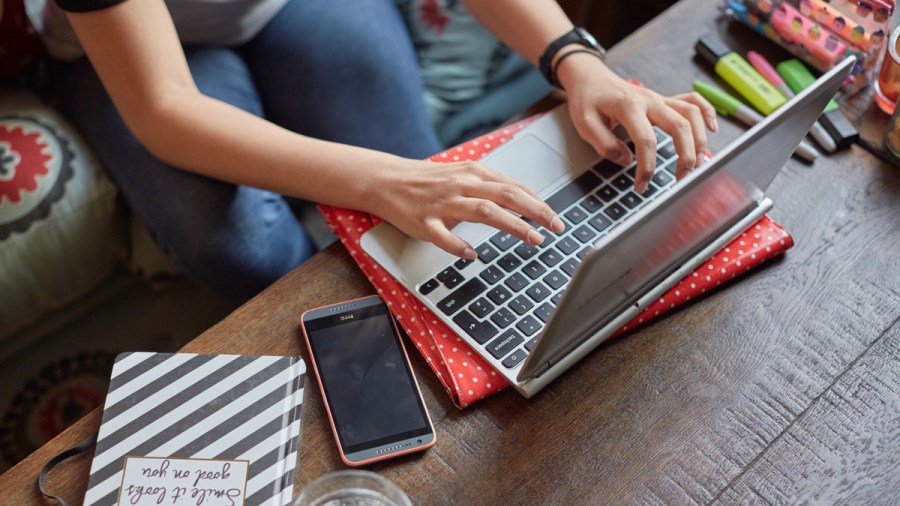 Teenage girl using a laptop