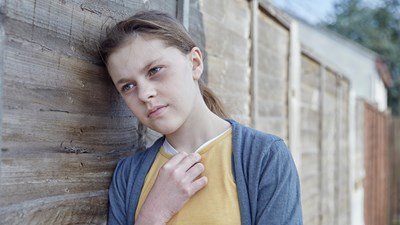 Young girl thinking and staring into the distance