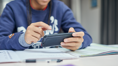 Teenager using phone