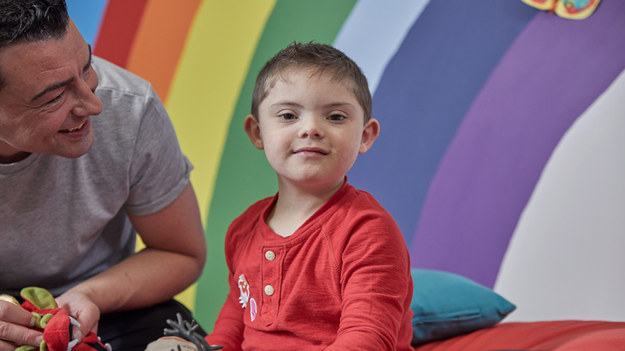 Young boy with social worker in service centre